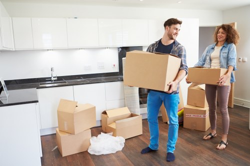 Professional movers working in a Maida Vale apartment building