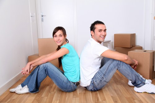 Professional movers loading items from a Maida Vale property